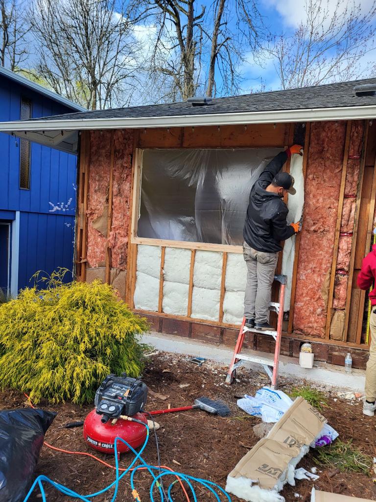 sister siding contractor doing window installation | sister siding