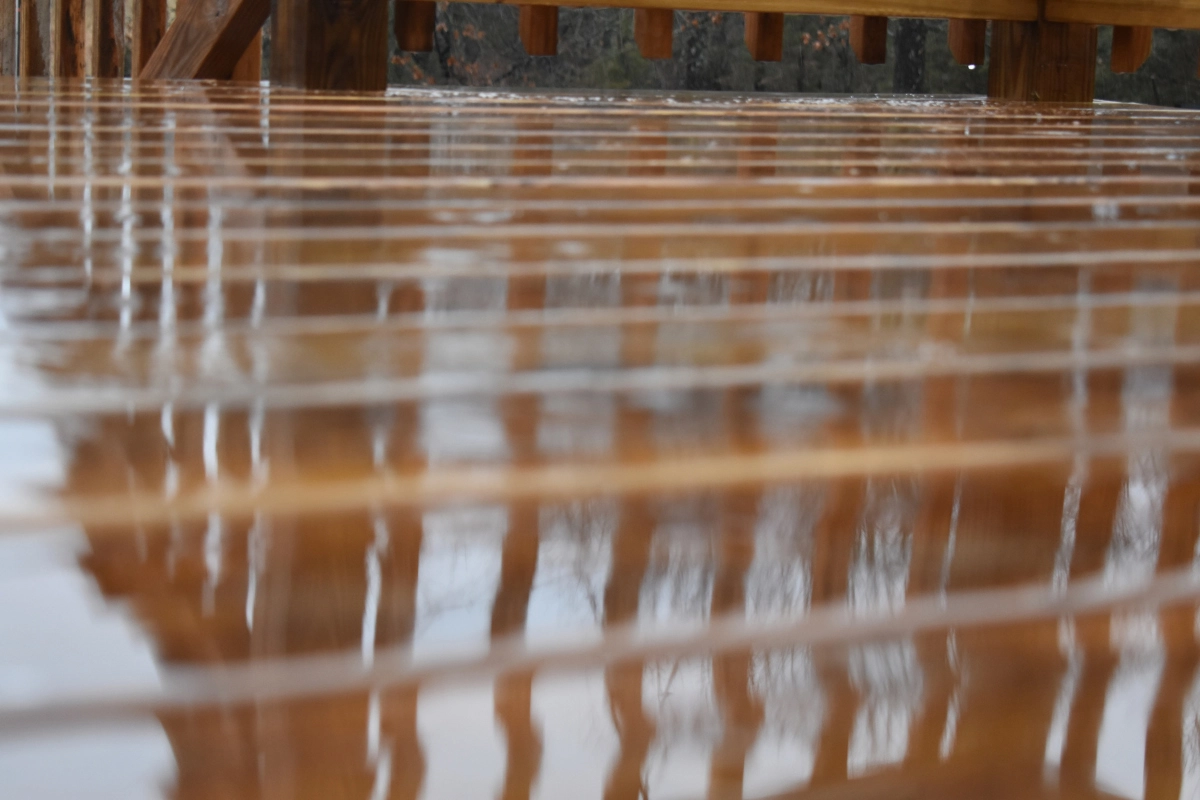 wooden deck wet from rain | sister siding