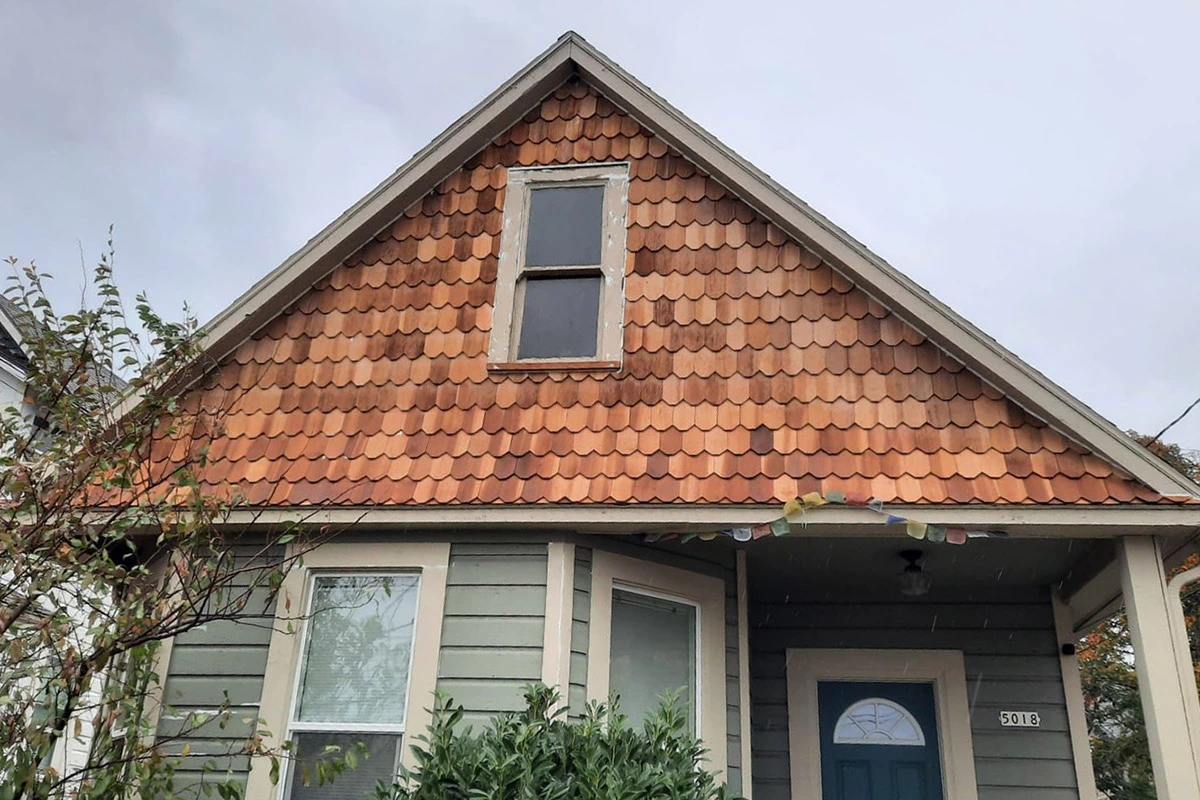 before image of home with wood shingle siding | sister siding