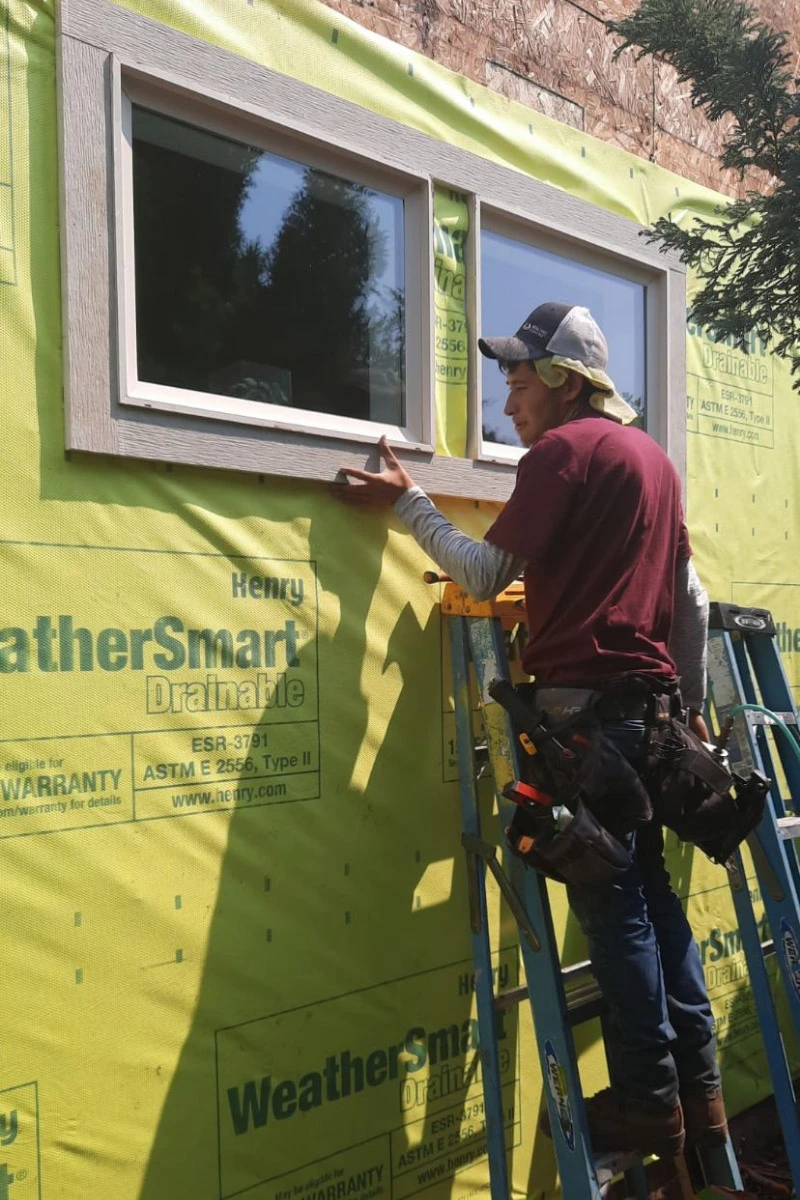 sister siding contractor doing home siding repair | sister siding