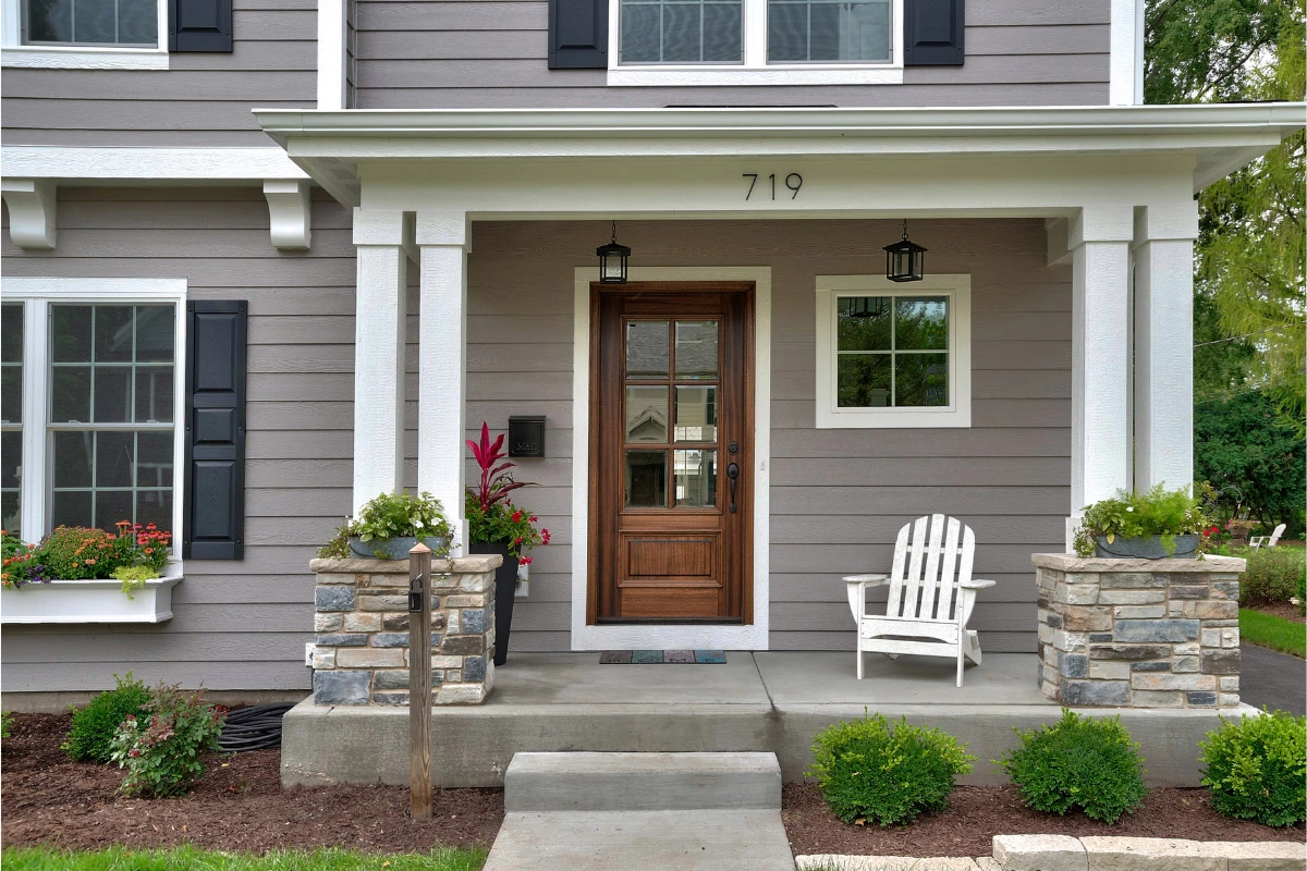 new dark wood door on home | sister siding