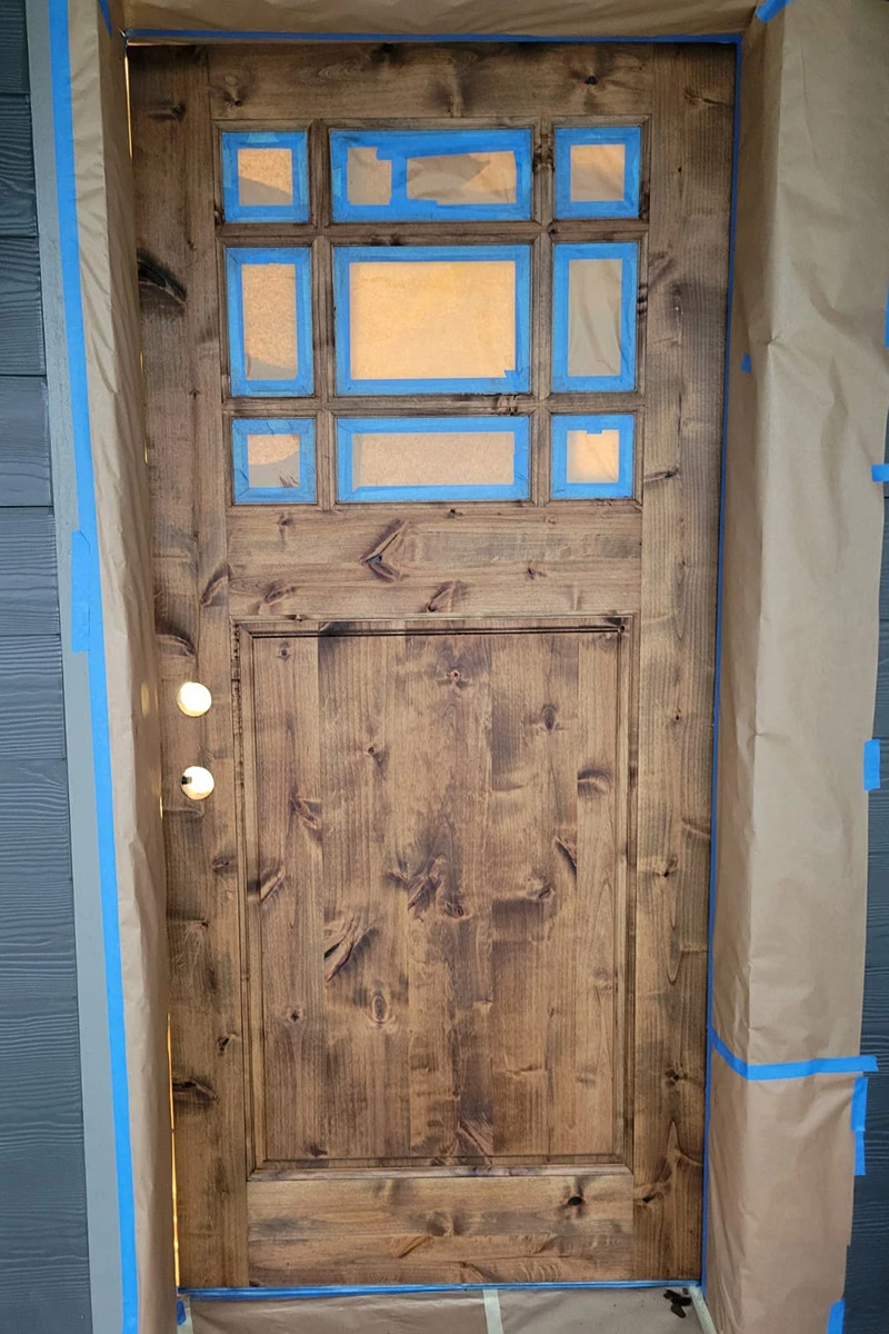 medium light wooden door | sister siding