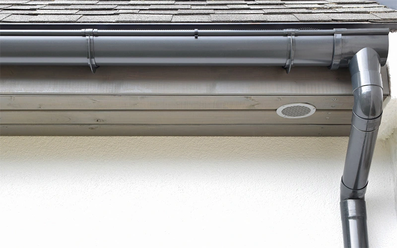 new-gutter-with-gutter-guards-to-protect-siding