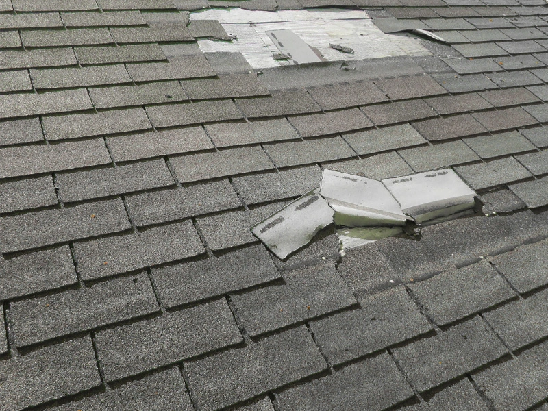 damaged-roof-panels-from-storm