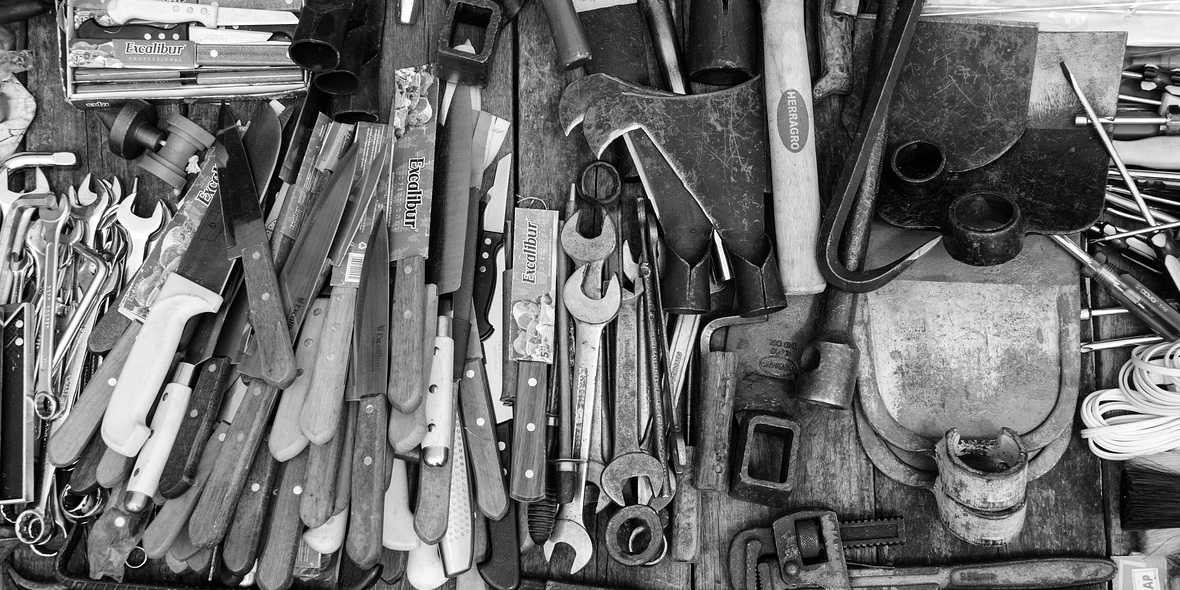 multiple-contractor-tools-laid-out-on-a-table