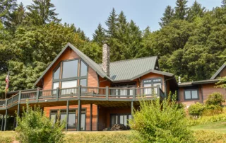 burnt-orange-and-forest-grey-green-home-painted-by-sister-siding--scaled