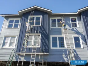BealsC1Progress Blue multi-story residential building with ladders and scaffolding
